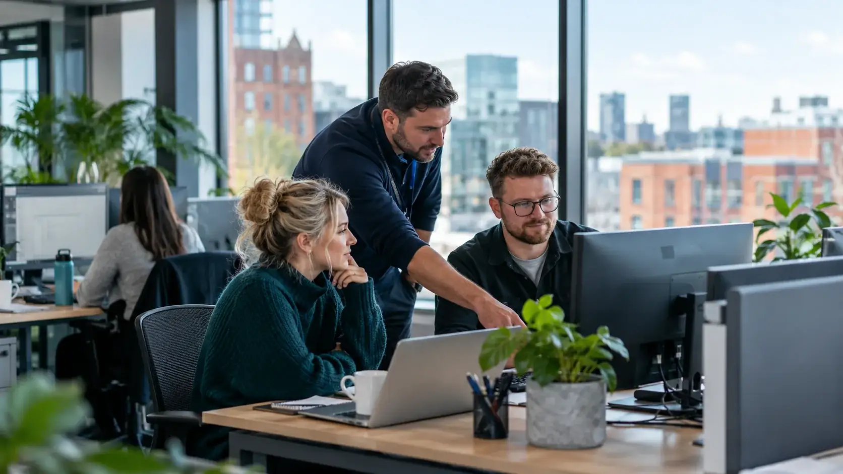 A small business team working in a modern North West office with professional IT support
